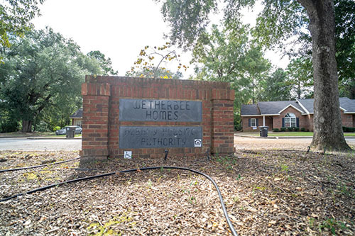 Brick sign stating Wetherbee Homes Housing Authority